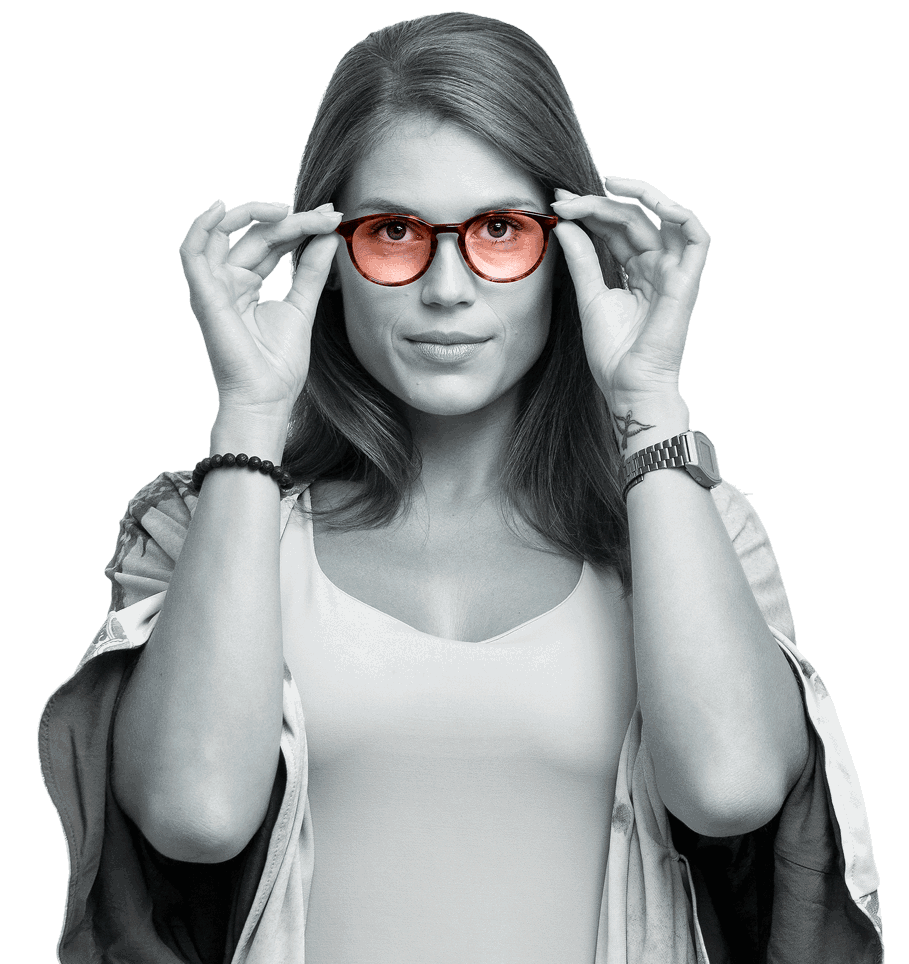 A customer trying on glasses fitted with fresh tinted lenses